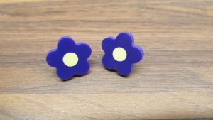 Purple daisy studs with yellow centres